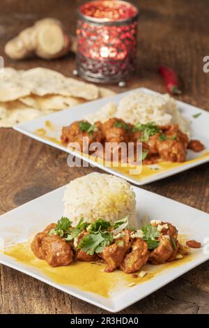 Indian Chicken Tikka Masala on wood Stock Photo