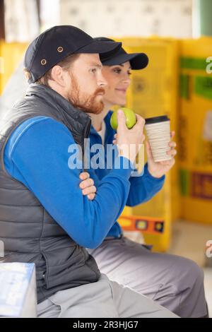 builders having a lunchbreak together Stock Photo