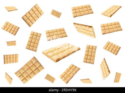 Delicious sesame kozinaki bars falling on white background Stock Photo