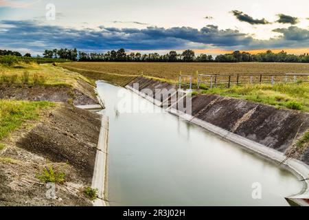 Channel for irrigation of cultivated fields Stock Photo