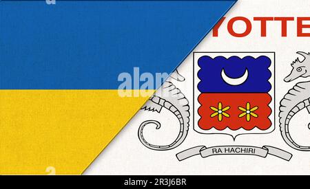 Flag of Ukraine and Mayotte. Ukrainian and Mayotte flags on fabric surface. Two Flag Together - Fabr Stock Photo