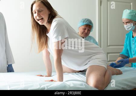 Child birth process, helping personal during labour Stock Photo