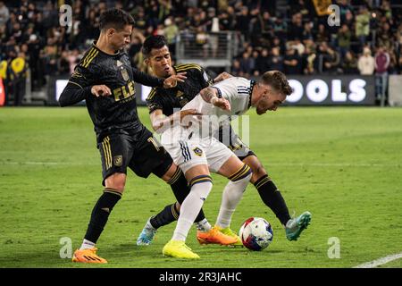 Los Angeles Galaxy midfielder Tyler Boyd (11) tries to shield LAFC midfielder Daniel Crisostomo (17) and midfielder Christopher Jaime (42) from the ba Stock Photo