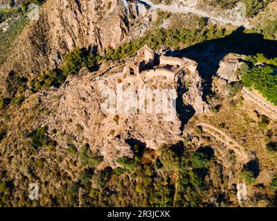Lanjaron Castle or Castillo de los Moros aerial panoramic view, it is a small medieval fortress in Lanjaron town in the Alpujarras area in the provinc Stock Photo