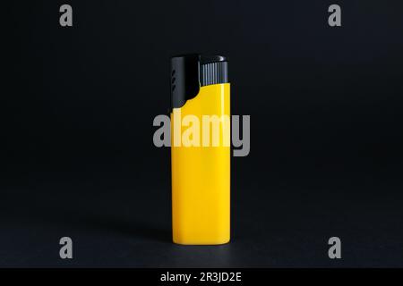 Stylish small pocket lighter on black background Stock Photo