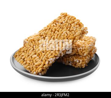 Plate with puffed rice bars (kozinaki) on white background Stock Photo