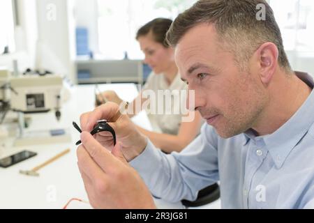 close up of a watchmaker at work Stock Photo