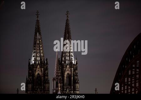 Saving energy, Cologne Cathedral with Hohenzollern Bridge dimly lit, Cologne, Germany, Europe Stock Photo