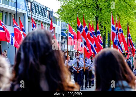 Sandnes, Norway, May 17 2023, Crowds Watching Norwegian Flag Carrying Parade Main Street Sandnes Norway Stock Photo