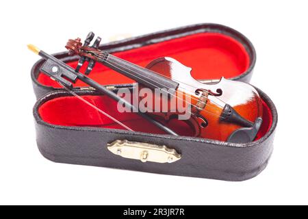 Violin in dark red velvet case. Stock Photo