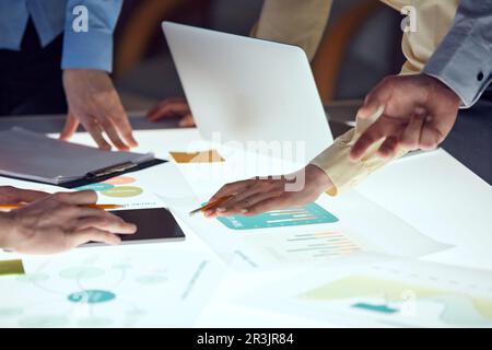Team of developers working on startup project, creating ideas and analyzing market over modern office interior. Sprint planning Stock Photo