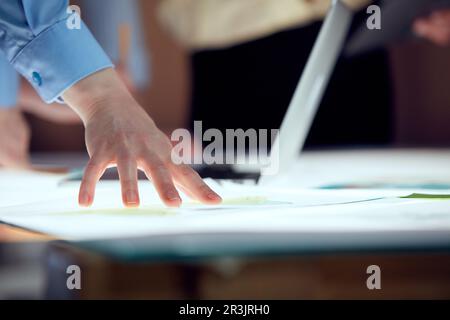Project manager creating new strategy of company with team, working on startup product over modern office interior design. Concept of teamwork Stock Photo