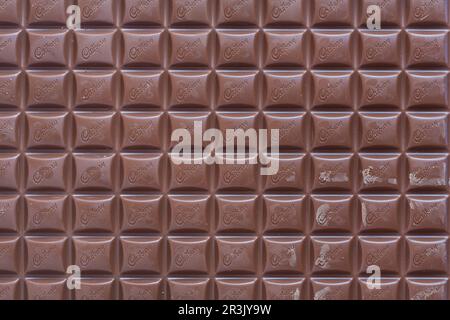Bar of Cadbury's Dairy Milk milk chocolate bar unwrapped - large 850g  bar showing Cadbury logo Stock Photo