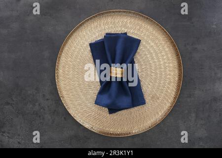 Tray with blue napkins and decorative ring on grey table, top view Stock Photo