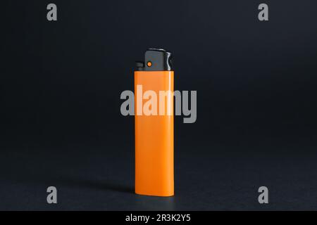 Stylish small pocket lighter on black background Stock Photo