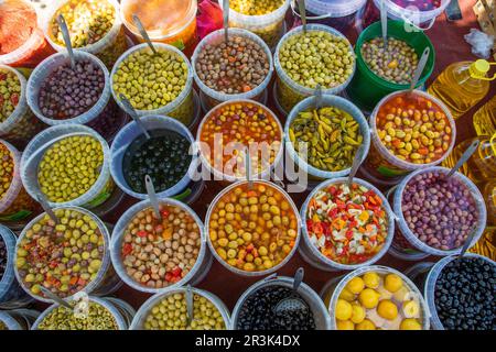 France, Orange - diferent kinds of olives for sale by an Algerian market merchant on the thursday market of the city. Stock Photo