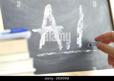 Blackboard with the letters AI wrote on it. Artificial Intelligence education in a classroom. Stock Photo