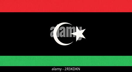 Flag of Libya. Libyan flag on fabric surface. Fabric texture. State of Libya. Libyan state symbol. A Stock Photo