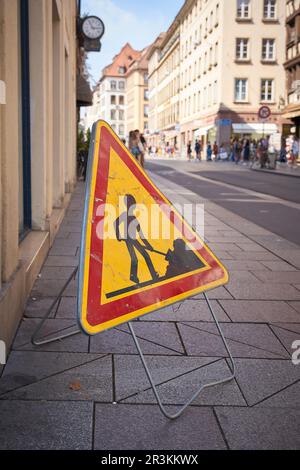 Construction site sign on a footpath in the old town of Strasbourg in France Stock Photo