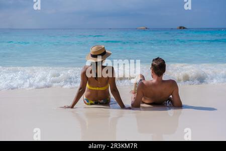 Couple of men and women on a trip to the tropical Island with white beach Similan Islands Thailand Stock Photo