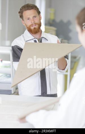 workers are talking in furniture factory Stock Photo