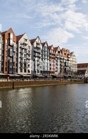 Modern buildings on Granary Island over the Motlawa River in Old Town. Abstract structure. Creative photo Tourism on the Motlawa Stock Photo