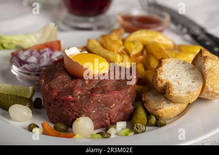 Steak tartar on a plate with an egg Stock Photo