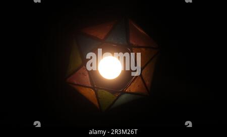 Hanging Decorative Lights at Night with a Dark Background Stock Photo