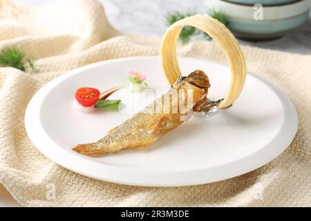 Deep-fried Small Sole Fish with spicy salt Stock Photo