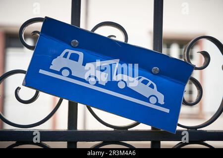 Warning sign indicating no parking at the gate to a private property in France Stock Photo