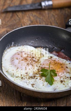 Fried eggs in a pan Stock Photo