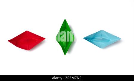 Three paper boats on a white background, top view Stock Photo