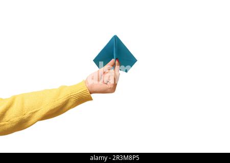 Woman hand holding blue paper airplane  isolated on  white background, freedom concept. Stock Photo