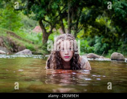 Portrait of Beautiful girl by the river Stock Photo - Alamy