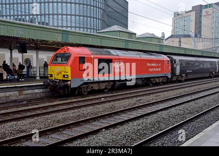 A DB Cargo Class 67 diesel electric locomotive pulling a Great Western Railway train at Cardiff Central Railway Station, March 2023 Stock Photo