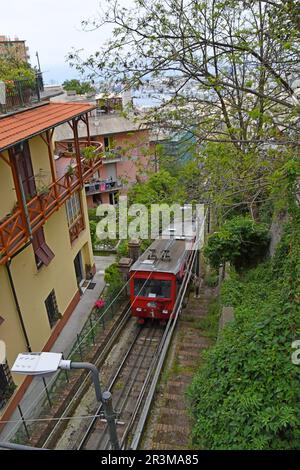 Train arriving at San Simone station on the Zecca-Righi  funicular cable operated railway in Genoa, Italy Stock Photo