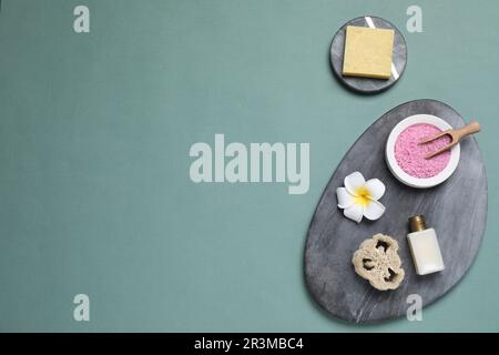 Flat lay composition with spa items on pale green background, space for text Stock Photo