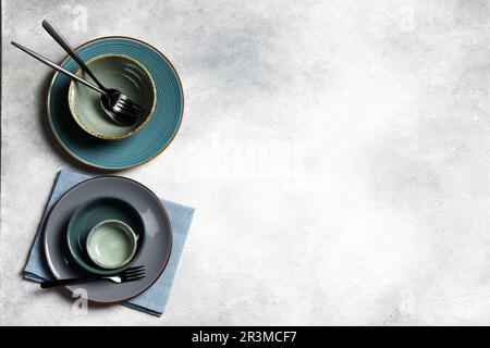 Stylish tableware on light grey table, flat lay. Space for text Stock Photo