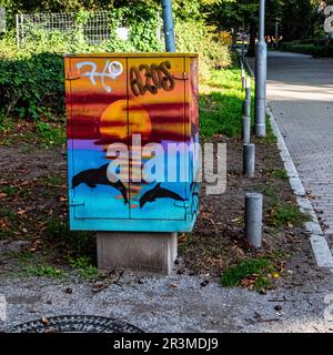 Sunset & whales, Painted Utility Box at Schäfersee Reinickendorf, Berlin. The circular lake is a remnant of the last Ice Age, Stock Photo