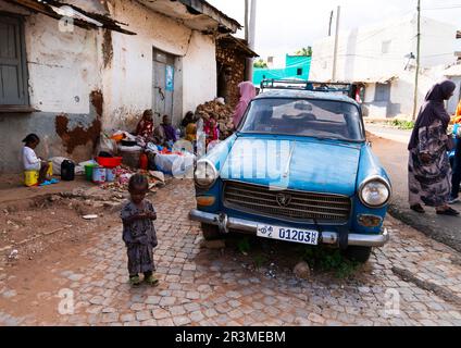 Old blue Peugeot 404 in the street, Harari Region, Harar, Ethiopia Stock Photo