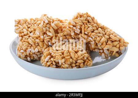 Plate with puffed rice bars (kozinaki) on white background Stock Photo