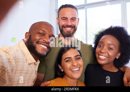 Selfie at work with colleagues, creative diverse team having fun in office Stock Photo