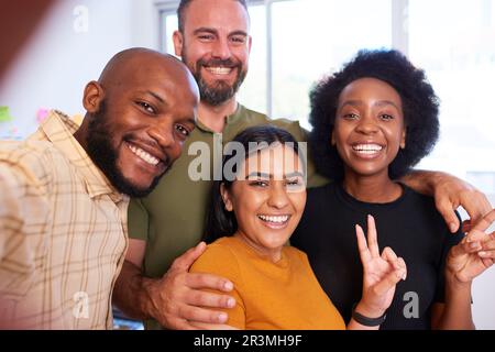 Selfie at work with colleagues, creative diverse team having fun in office Stock Photo