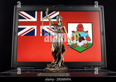 Symbol of law and justice with Bermuda Flag on laptop. Studio shot. Stock Photo