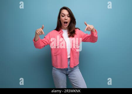 active emotional black-haired lady in casual style on studio background Stock Photo