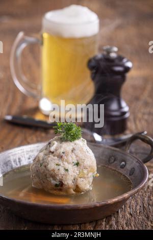 soup in the pot, bread, wooden spoon on the table closeup Stock Photo ...