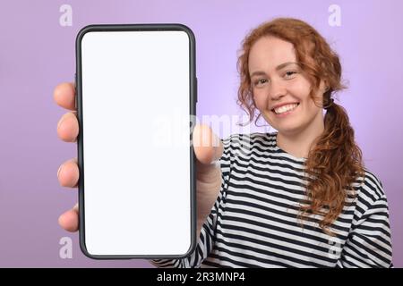 cute boy child showing smartphone with white blank screen Stock Photo