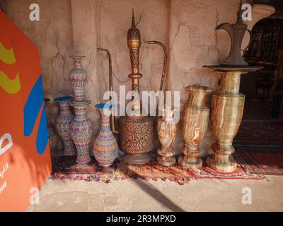 20 March 2023, Dubai, UAE: Al Seef Heritage Souq Arabic Market. Dubai Deira. souvenir shop with crockery and vases. Stock Photo