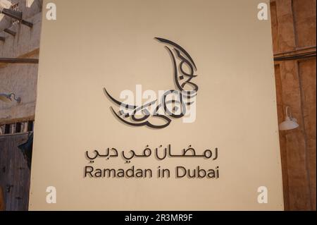 20 March 2023, Dubai, UAE: Al Seef old town village in Dubai, Ornamental Arabic sign about Muslim holy month Ramadan Kareem. Ramadan Kareem greeting Stock Photo