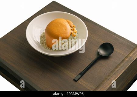 Delicious Homemade Oat Lava Cake with White Sesame in White Ceramic Plate erved with Spoon on the Wooden plank. Delicious Bakery Concept, Space for te Stock Photo